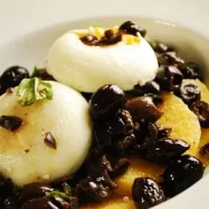 poached eggs over polenta and olive tapenade