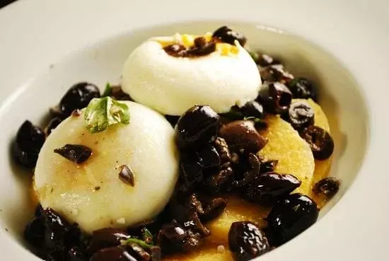 poached eggs over polenta and olive tapenade